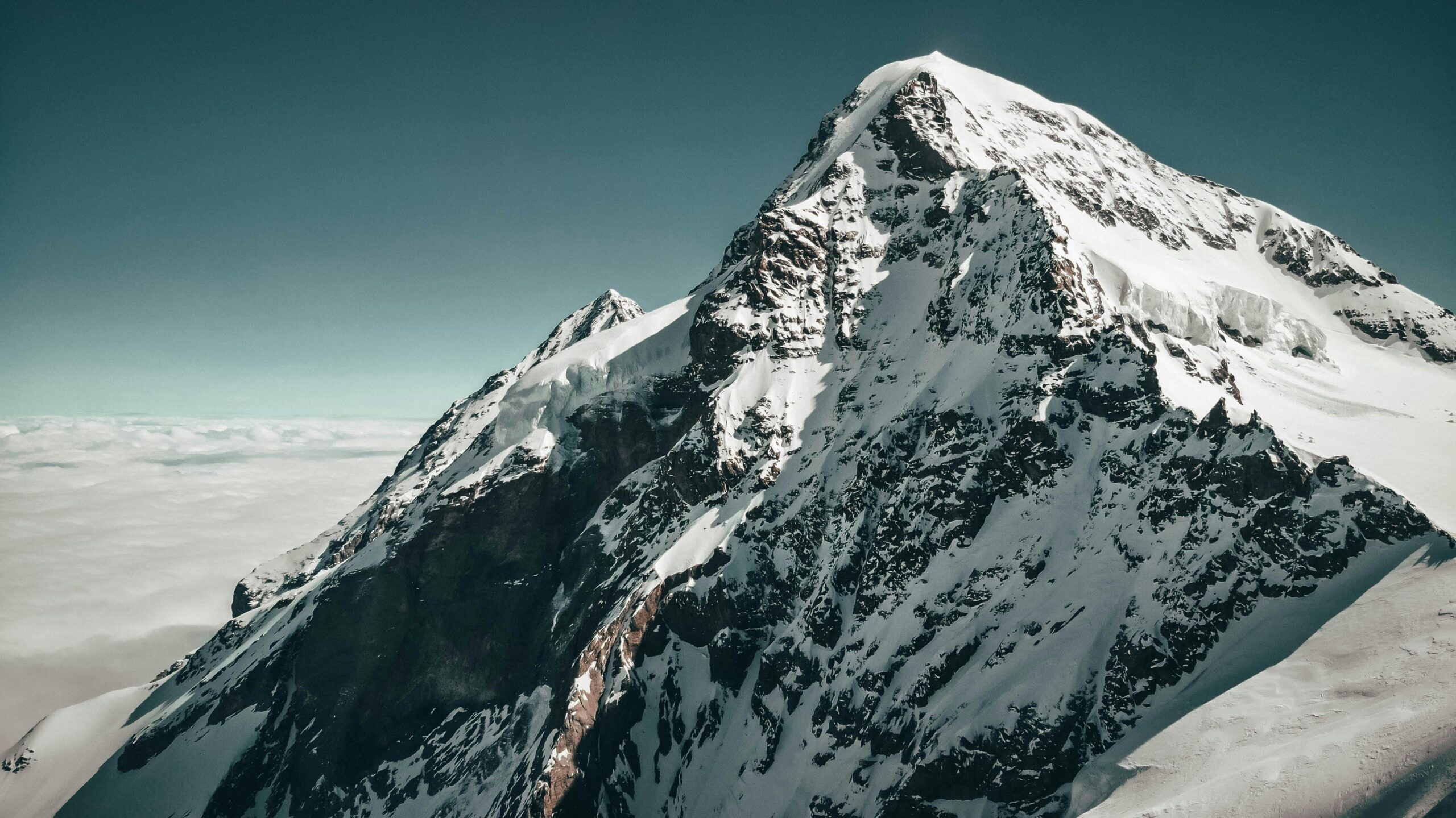 Breathtaking snowy mountain summit in Switzerland, showcasing winter's natural beauty.